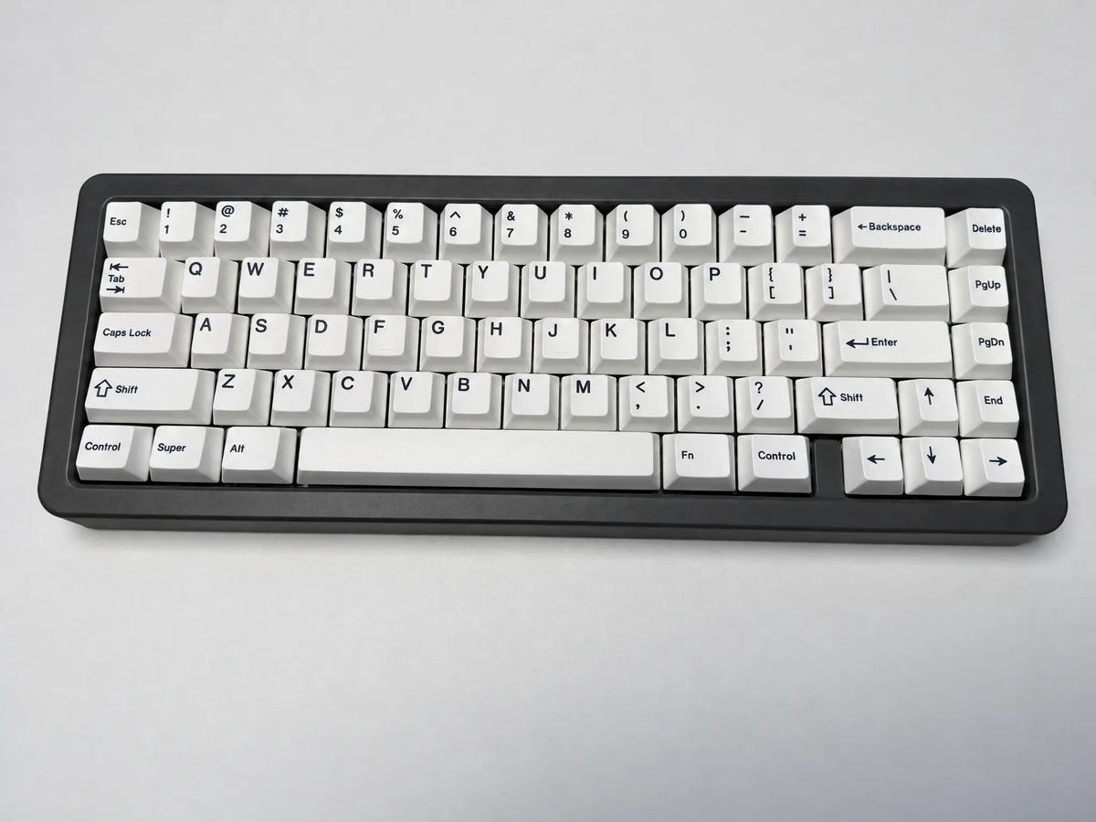 Odin Gaming Aurora65 LITE Space Grey keyboard, full front view on a light background showing the grey case and dedicated arrow keys.