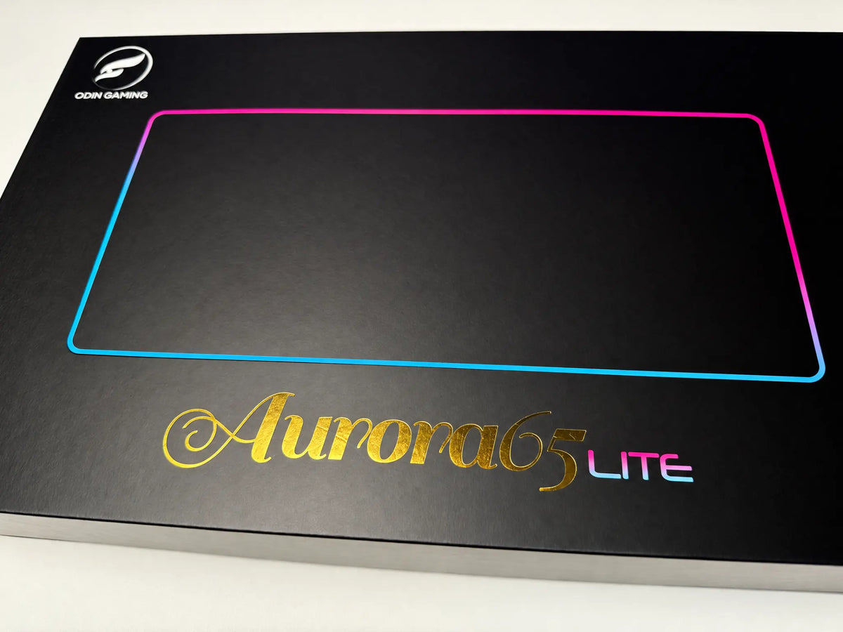 Odin Gaming Aurora65 LITE retail box with the Odin logo, iridescent keyboard outline and gold Aurora65 branding.