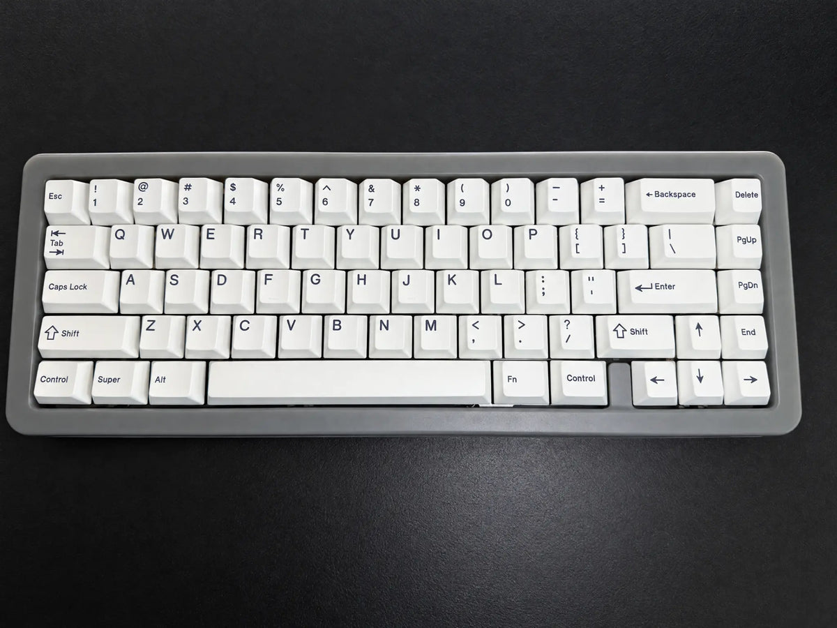 Odin Gaming Aurora65 LITE Space Grey fully built 65% mechanical keyboard, top view on a dark background with white keycaps and arrow keys.