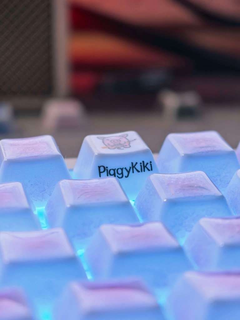 PiggyKiki collector keyboard keycaps displayed with the mousepad