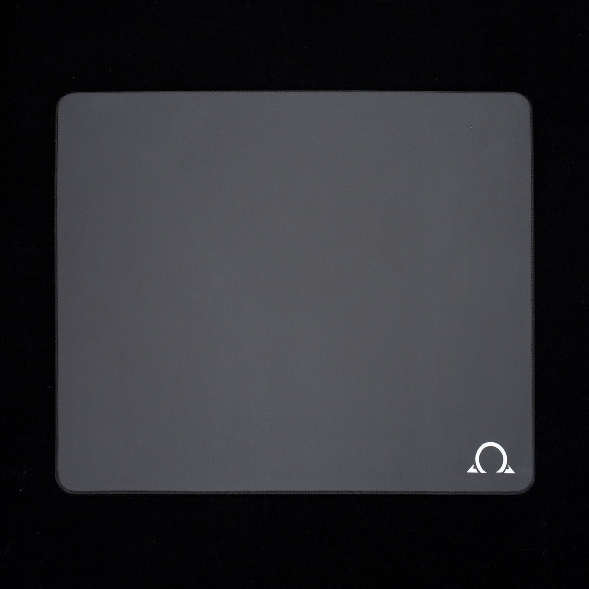 ERRENNIR OMEGA gaming mousepad, square gray cloth surface with rounded corners and white Omega logo, top view.